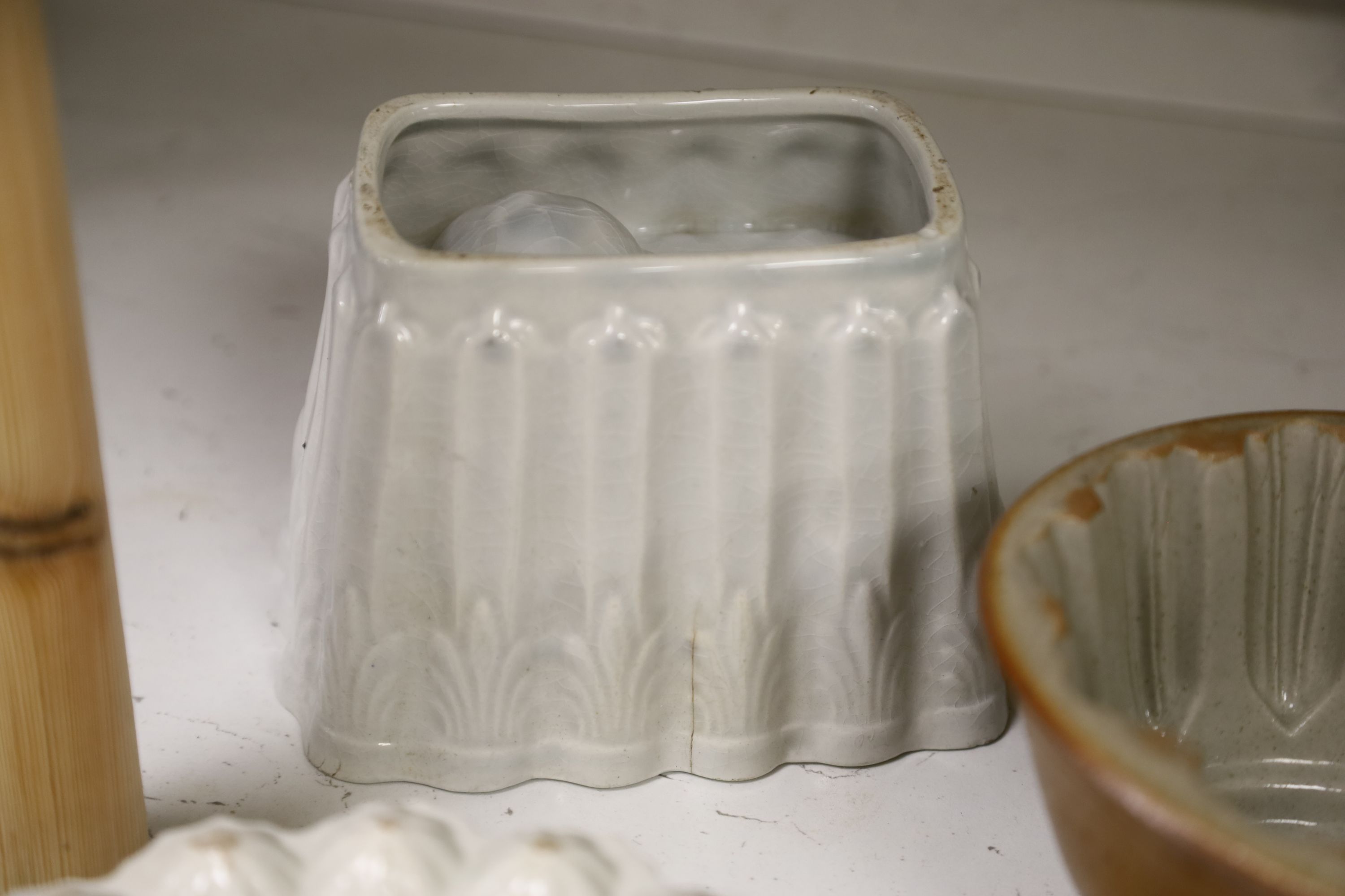 Six pottery jelly moulds including one Shelley